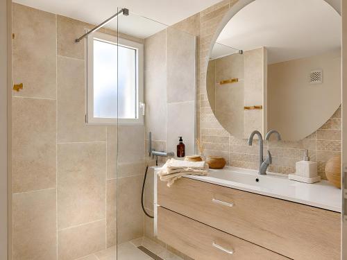a bathroom with a shower with a sink and a mirror at Studio "Bulle de Sainte-Baume" in Plan dʼAups