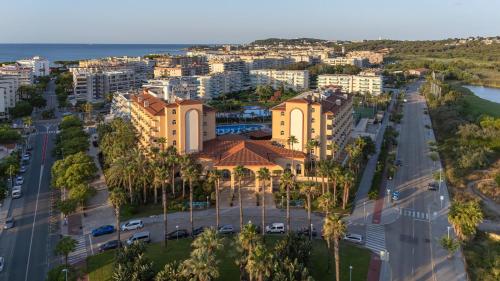 an aerial view of a city with buildings at Ohtels La Hacienda in La Pineda