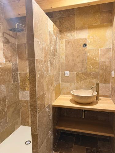 a bathroom with a sink and a shower at La Promesse by Hillis in Marennes
