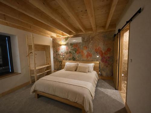 a bedroom with a large bed in a room at La Promesse by Hillis in Marennes