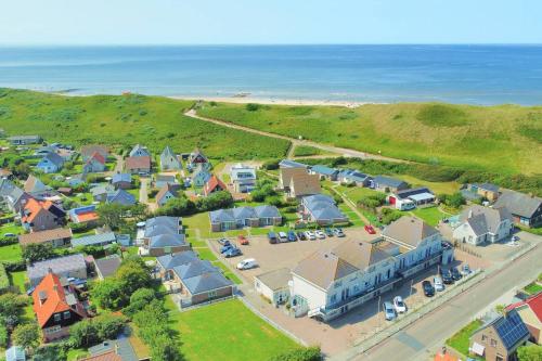 an aerial view of a small town with the ocean at Seinpaal 29 Callantsoog in Callantsoog