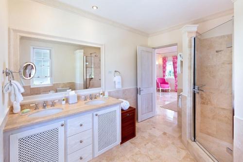 a bathroom with a sink and a shower at Fairway Views with Private Pool - High Spirits in Saint James