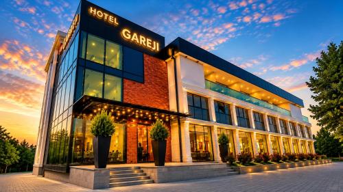 a large building with a sign that reads safer at Hotel Gareji Kakheti in Sagarejo