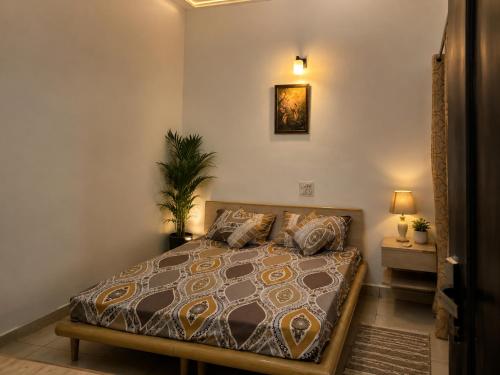 a bedroom with a bed in a room at The Golden Window Villa in Amritsar