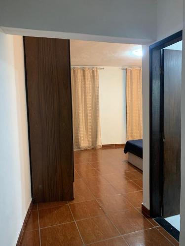 a living room with a door to a room at Sobiuai 72 in Ouro Preto