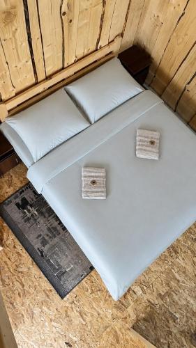 two white pillows sitting on the floor of a boat at Карпатські Мандри in Verkhovyna