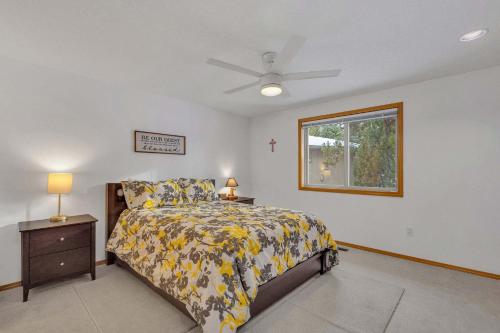 a bedroom with a bed and a window at Mt. St. Helens - Unit 9 in Sunriver