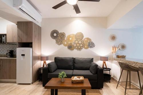 a living room with a couch and a table at Syrena Multi Listing in Playa del Carmen