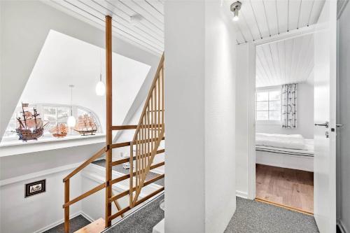 a staircase leading to a bedroom in a house at 0194-Romo-Rabjergvej-76 in Høm