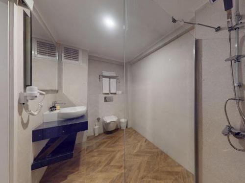 a bathroom with a sink and a toilet and a shower at Casa Mare Bodrum in Bodrum City