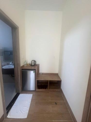 a small room with a table and a counter at Minh's homestay in Long Bình
