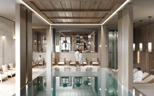 a rendering of a hotel lobby with a swimming pool at West Hill Apart Hotel in Kopaonik