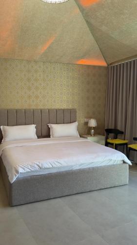 a bedroom with a large bed in a room at Wadi Bani Khalid Oasis in Dawwah