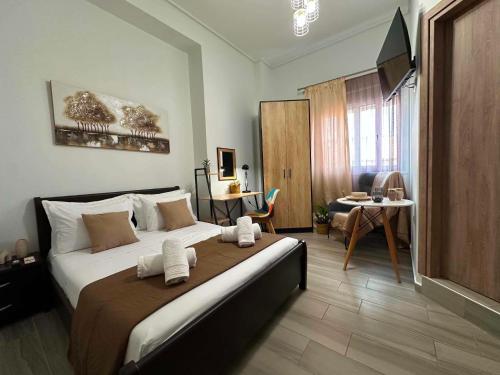 a bedroom with a large bed in a room at Breeze Apartments Megara - Nest in Megara