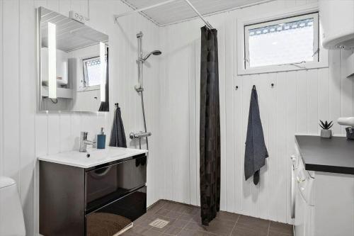 a small bathroom with a sink and a shower at LF16124-Farso-Bjarkesvej-4 in Farsø