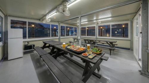 a dining room with a table with food on it at Yeosu Onueli Pension in Yeosu