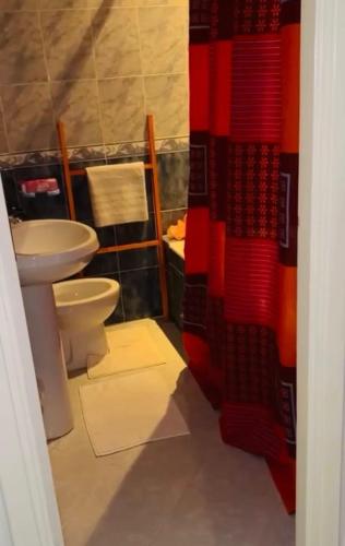 a bathroom with a toilet and a sink at شمس in Hammamet Nord