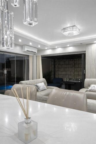 a living room with a couch and a table at The Seamless Oasis in Cape Town