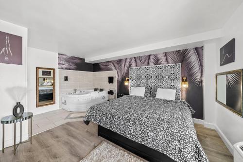 a bedroom with a bed and a bath tub at Rodeway Inn in Somerset