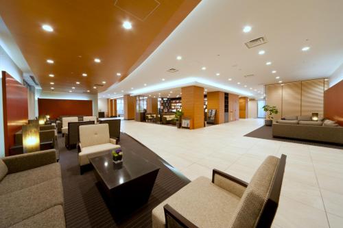 a lobby of a hotel with couches and chairs at Almont Hotel Kyoto in Kyoto