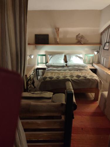 a bedroom with a bed in a room with at Mühle am Sandbach in Niedererbach
