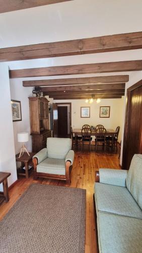 a living room with a couch and a table at Apartamentos Nogueret in Benasque