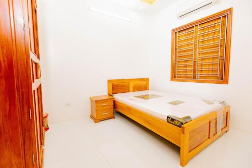 a bedroom with a bed and a window at BTLk D16- 27-02 in Thủy Triều