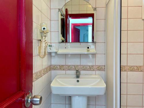 a bathroom with a sink and a mirror at Villa Nergis in Bitez