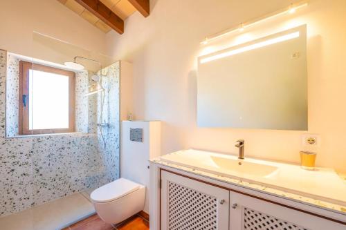 a bathroom with a sink and a toilet and a shower at Mercader in Alcudia