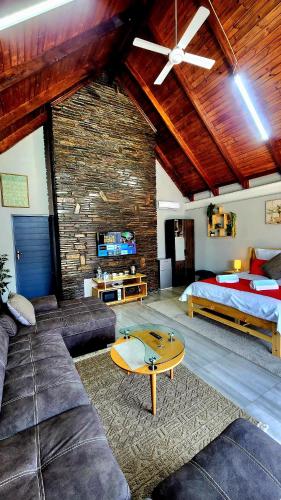 a living room with a couch and a bed at Blairgowrie Skyline in Johannesburg