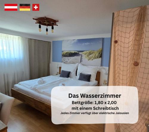 a room with a bed with a poster on the wall at Dreamly Suites Oslip in Oslip