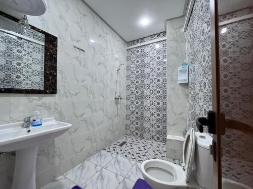 a bathroom with a toilet and a sink at Riad Ba brahim in Rabat