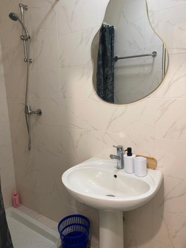 a bathroom with a sink and a mirror at Era in Chancelade