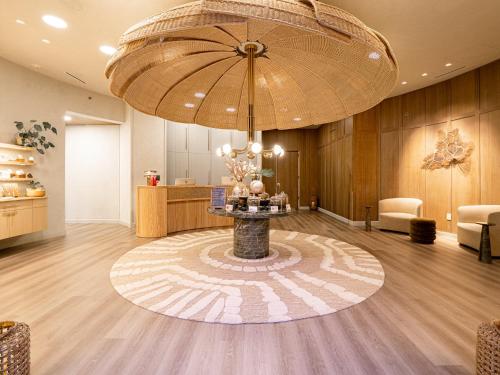 a lobby with a table in the middle of a room at Kimpton Seafire Resort + Spa by IHG in West Bay