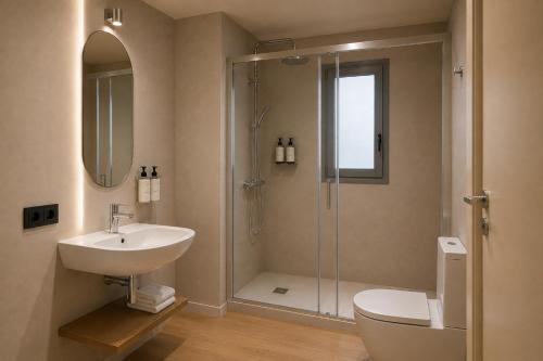 a bathroom with a shower and a sink and a toilet at Colectia Hotel Santa Lucía in Seville