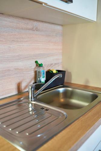 a kitchen sink with a bottle of soap on it at PrimeBnb Bad Hersfeld in Bad Hersfeld