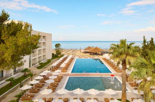 an aerial view of a resort with a swimming pool and beach at SOL by Meliá Tropikal Durres in Durrës