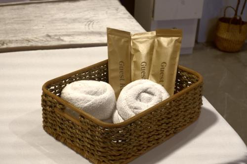 a basket of towels and bags on a table at Yanna's Unit - 3Bedroom with Breakfast in Baguio