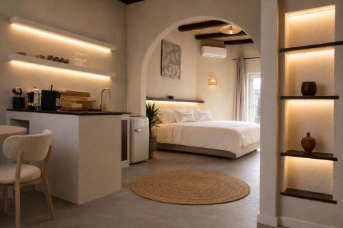 a bedroom with a bed and a kitchen with a table at SLEEP INN ANTWERP - Short & Longterm rentals in Antwerp