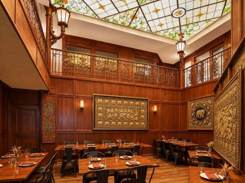 a restaurant with tables and chairs and a glass ceiling at Park Hotel Condominiums in Park City
