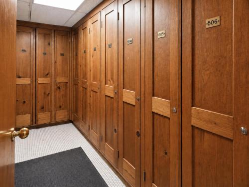 a locker room with wood paneling and a door at Park Hotel Condominiums in Park City