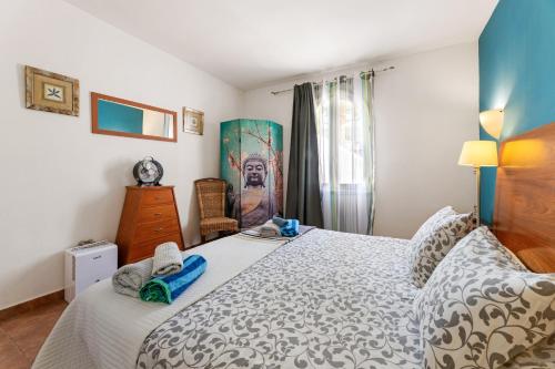 a bedroom with a large bed and a window at The Colors House, 639 Private Apartment in Costa Teguise