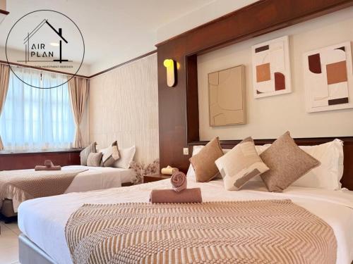 a hotel room with two beds in a room at PD Full Seaview Water Chalet with Private Bathtub in Port Dickson