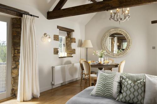 a living room with a table and a couch at Perry Cottage in Halford