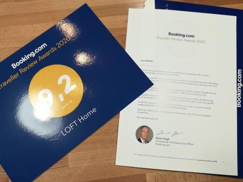 two cards on a table with a passport and a document at LOFT Home in Daugavpils