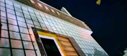 a tall building with lots of windows on it at Sri varahi rest house in Avanigadda