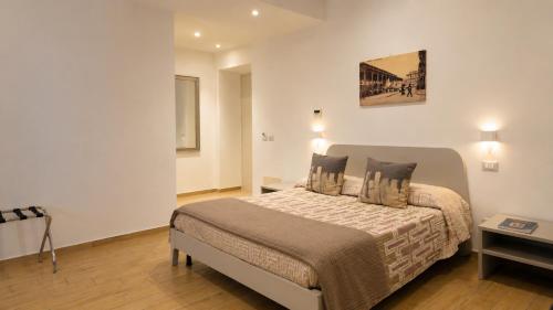 a bedroom with a large bed in a room at Real Rooms in La Spezia