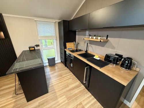 a kitchen with a counter and a counter top at Rosetta Retreats in Peebles