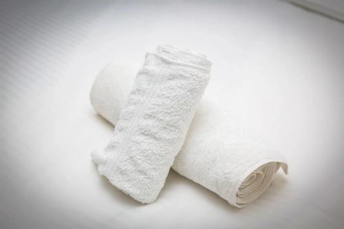 a roll of white toilet paper sitting on a table at Premier Place, Sky Suites in Accra