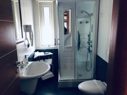 a bathroom with a shower and a sink at Hotel Grotte in Mongiove